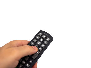 Midsection of person holding camera against white background