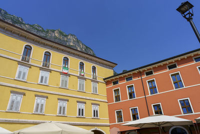 Low angle view of building against clear blue sky