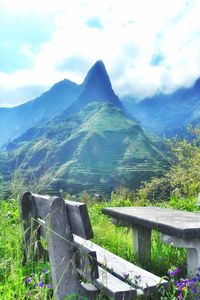 Scenic view of mountains against cloudy sky