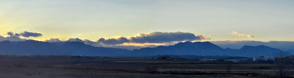 Scenic view of landscape against sky during sunset