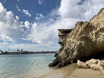 Panoramic view of sea and buildings against sky