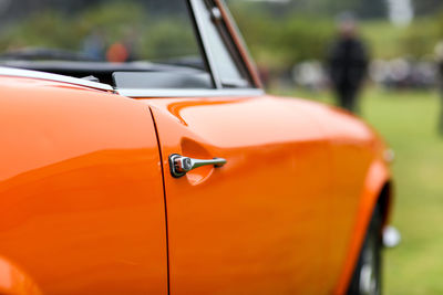 Close-up of car parked against blurred background