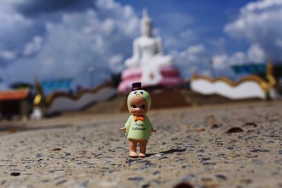 Close-up of stuffed toy on sand