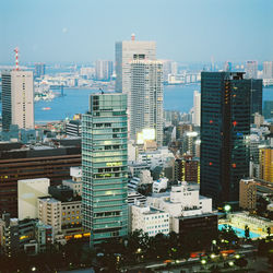 Aerial view of city buildings against sky