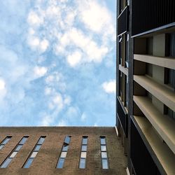 Low angle view of building against cloudy sky