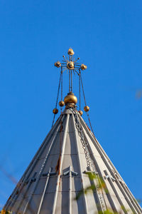 Low angle view of building against clear blue sky