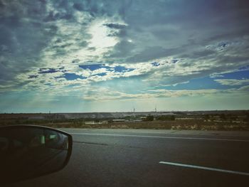 View of road against cloudy sky