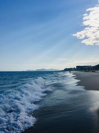 Scenic view of sea against blue sky