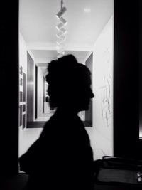 Rear view of men in corridor