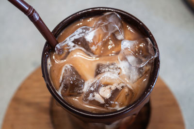 High angle view of coffee in glass on table