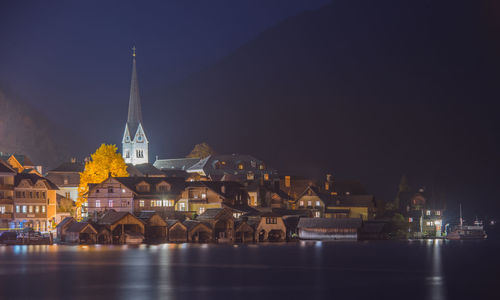 Illuminated buildings in city at night