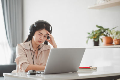 Woman using laptop on table