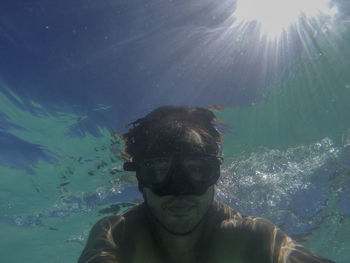 Portrait of man swimming in sea