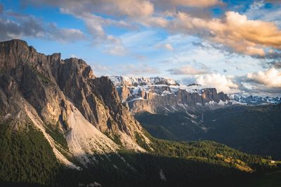 Scenic view of mountains against cloudy sky