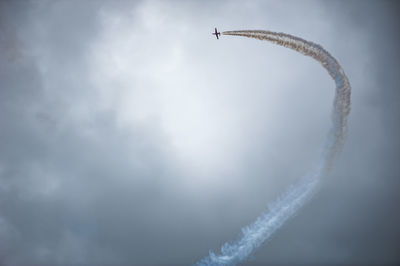 Low angle view of vapor trail against sky