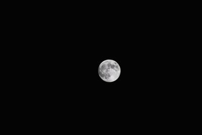 Low angle view of full moon in sky