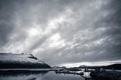 Scenic view of lake against sky during winter