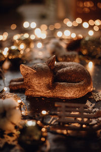 Close-up of illuminated christmas lights on table