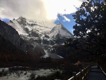 Scenic view of snowcapped mountains against sky during winter