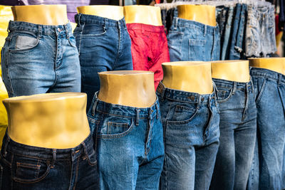 Clothes standing on display at shop