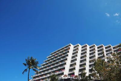 Low angle view of building against blue sky