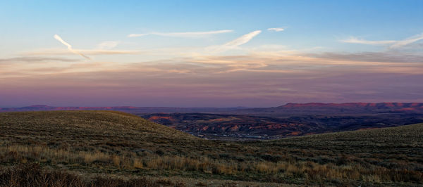 Scenic view of landscape against sky during sunset