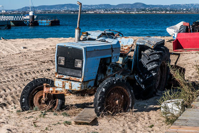 Bicycles on beach against the sea