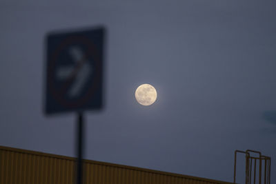 Low angle view of moon against sky at night