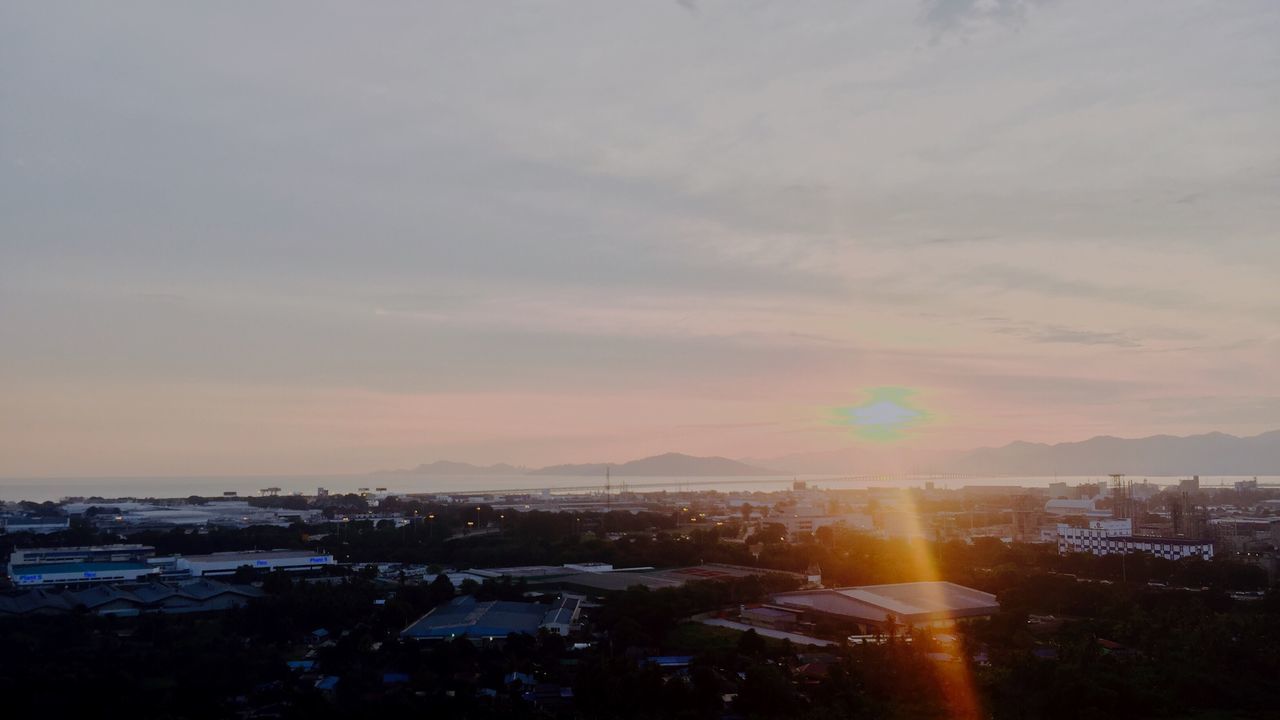 sky, sunset, city, architecture, building exterior, beauty in nature, no people, nature, built structure, scenics, outdoors, tranquility, water, sea, cityscape, cloud - sky, mountain, day