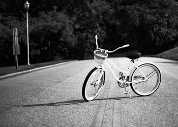 Bicycle on road during sunny day