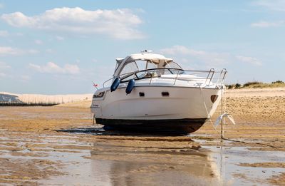 Ship moored on beach