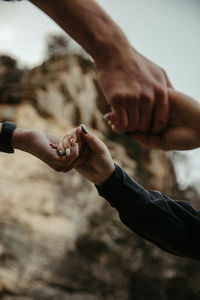 Close-up couple holding hands