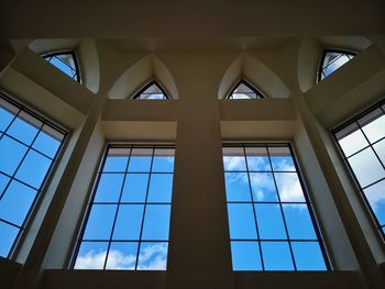 Low angle view of glass window in building