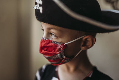 Close-up portrait of boy wearing hat