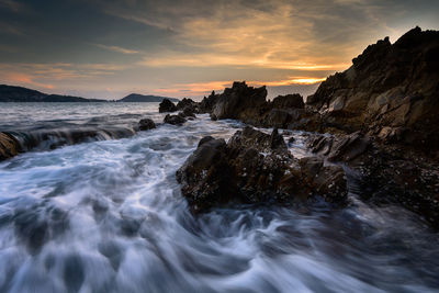 Scenic view of sea against sky during sunset