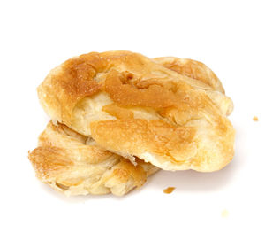 Close-up of bread against white background