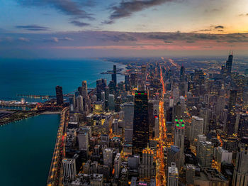 High angle view of illuminated cityscape against sky