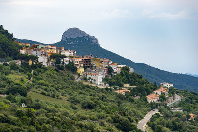 High angle view of townscape and mountains against sky