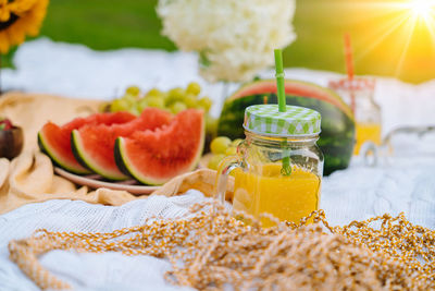 Close-up of fruits in glass jar on table