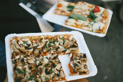 High angle view of pizza served on table