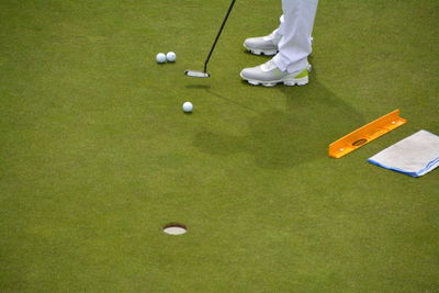 Low section of golfer playing on golf course