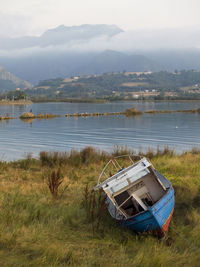 Nautical vessel on lake against sky