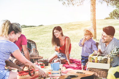 View of family at picnic on field