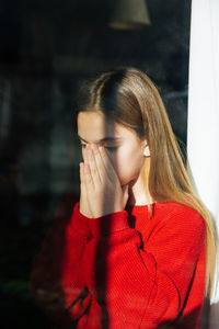Portrait of a girl covering face