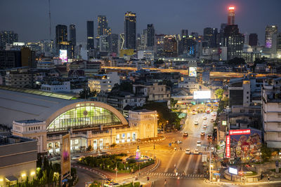 High angle view of illuminated buildings in city at night