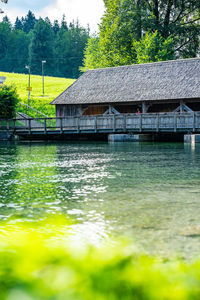 House by lake against building