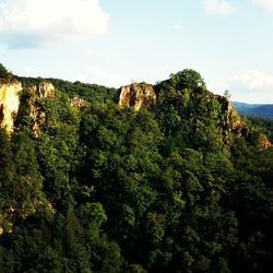 Scenic view of mountains against cloudy sky