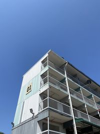 Low angle view of building against clear blue sky