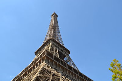 Low angle view of tower against blue sky