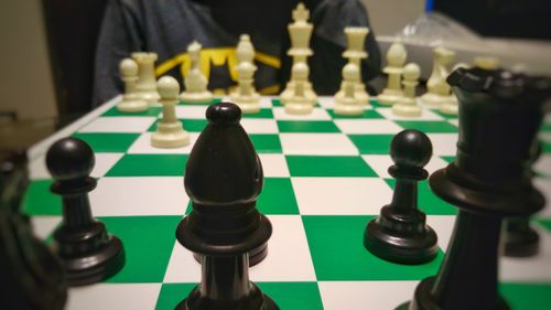 Low angle view of chess playing on table